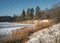 Atmospheric winter landscape. Bright winter Sunny landscape. Frosty day on the lake