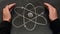 Atom symbol drawn on a blackboard