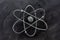 Atom symbol drawn on a blackboard