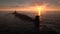 Atomic submarine in ocean at sunset