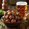 an atractive and tastefull image of meatballs portion and pint of beer together