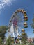 Atraktsion colorful ferris wheel against the sky