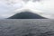 Atsonupuri Volcano of Iturup island, the Sea of Okhotsk, Kuril Islands, Russia, claimed by Japan. The top of volcano hidden in fog