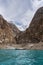 Attabad lake and rocky mountain with local boat in Pakistan