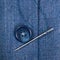 Attaching of button to blue silk jacket