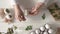 Attaching fresh herbs to raw Easter eggs - preparation for dyeing with onion peels