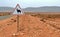 attention camel street sign on deserted road