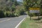 attention cyclists along the highway, written in Portuguese on a sign that is on a road, copy space to the left