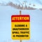 Attention sign against snow and chair lifts