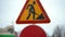 Attention sign. Roadworks signs on a street. Roadworks sign on a road. Road sign repair work and detour arrow. Repair