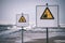 attention signs near sea with stormy weather - vintage film look
