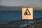 attention signs near sea with stormy weather - vintage retro loo