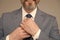 Attention to details. Male hands tie necktie grey background. Formal tie collection. Tying neck tie. Mens accessories