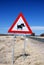 Attention warthogs crossing, road sign in Namibia