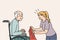 Attentive caregiver take care of mature patient in wheelchair