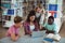 Attentive classmates using laptop in library