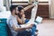 Attentive couple reviewing map while sitting on floor at apartment