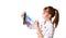 Attentive female doctor in lab coat and disposable mask studying different examples of latex gloves in her hands.