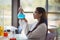 Attentive schoolgirl doing a chemical experiment in laboratory