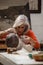 Attentive senior woman making a clay sculpture