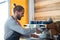 Attentive waiter making cup of coffee