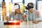 Attentive young people playing chess while wearing virtual reality glasses