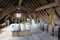 An attic filled with boxes, sacks, ropes and barrels in the colonial town of Louisbourg Nova Scotia