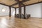 Attic loft open space empty interior with beams, windows, stairway, wooden floor.