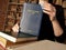 Attorney holds CONSTITUTIONAL LAW book. Constitutional law, the body of rules, doctrines, and practices that govern the operation