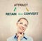 Attract, Retain and Convert concept with young business woman