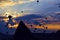 Attraction dozens of balloons climbed into the night sky above the conical peaks of the rocks in Cappadocia