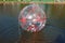 Attraction on the water, ZORB, the boy in a bowl on the water. Water attractions, rest, vacation, vacation