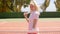Attractive active blond woman playing tennis