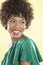 Attractive African American woman in an off shoulder dress looking away over colored background