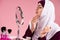 Attractive Arabian woman in hijab looks on face