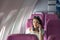 Attractive asian woman passenger of airplane calling mobile phone on board. tourism traveler concept.