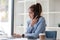 Attractive Asian woman using laptop in online meeting. Businesswoman using mobile phone talking with colleague sitting