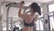 Attractive Asian young muscular girl in sportswear doing pull-ups exercise and chin up at fitness sport gym for strength workout
