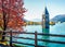 Attractive autumn view of Tower of sunken church in Resia lake. Amazing morning scene of Italian Alps, South Tyrol, Italy, Europe