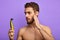 Attractive awesome male holding a shaving supply