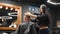 Attractive barber girl cutting man`s hair with scissors and comb. Female hair cutter working serving client. Stylish man