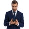 attractive bearded businessman in navy blue suit reading emails