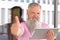 Attractive bearded man holding a tablet pc