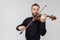 Attractive bearded violist man playing instrument