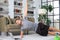 Attractive beared man doing plank exercise at home. Fitness is the key to health