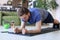 Attractive beared man doing plank exercise at home during quarantine. Fitness is the key to health