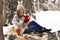 Attractive,beautiful,cute,pretty girl hold toy,girl with big,red heart in her hands,sit in warm plaid,has picnic in winter forest