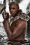 Attractive Black Man with Boa Constrictor Snake