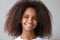 Attractive black teenager girl smiling looking at camera