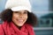 Attractive black woman smiling with winter hat and scarf